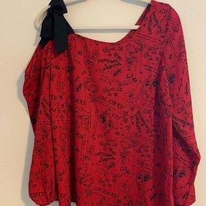 A beautiful red top with fun details!